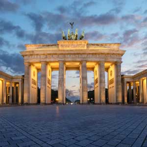 Brandenburg Gate at sunset, a famous landmark of Berlin, elegant architecture in the evening, a tourist attraction in Germany, a perfect backdrop for upscale escort service offers.