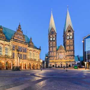 A cityscape with historic architecture and a cathedral in the city center, ideal for exclusive escort service experiences in the city.