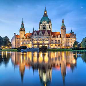 Castle with water reflection at night, historical architecture, Berlin, Germany, for escort service website.